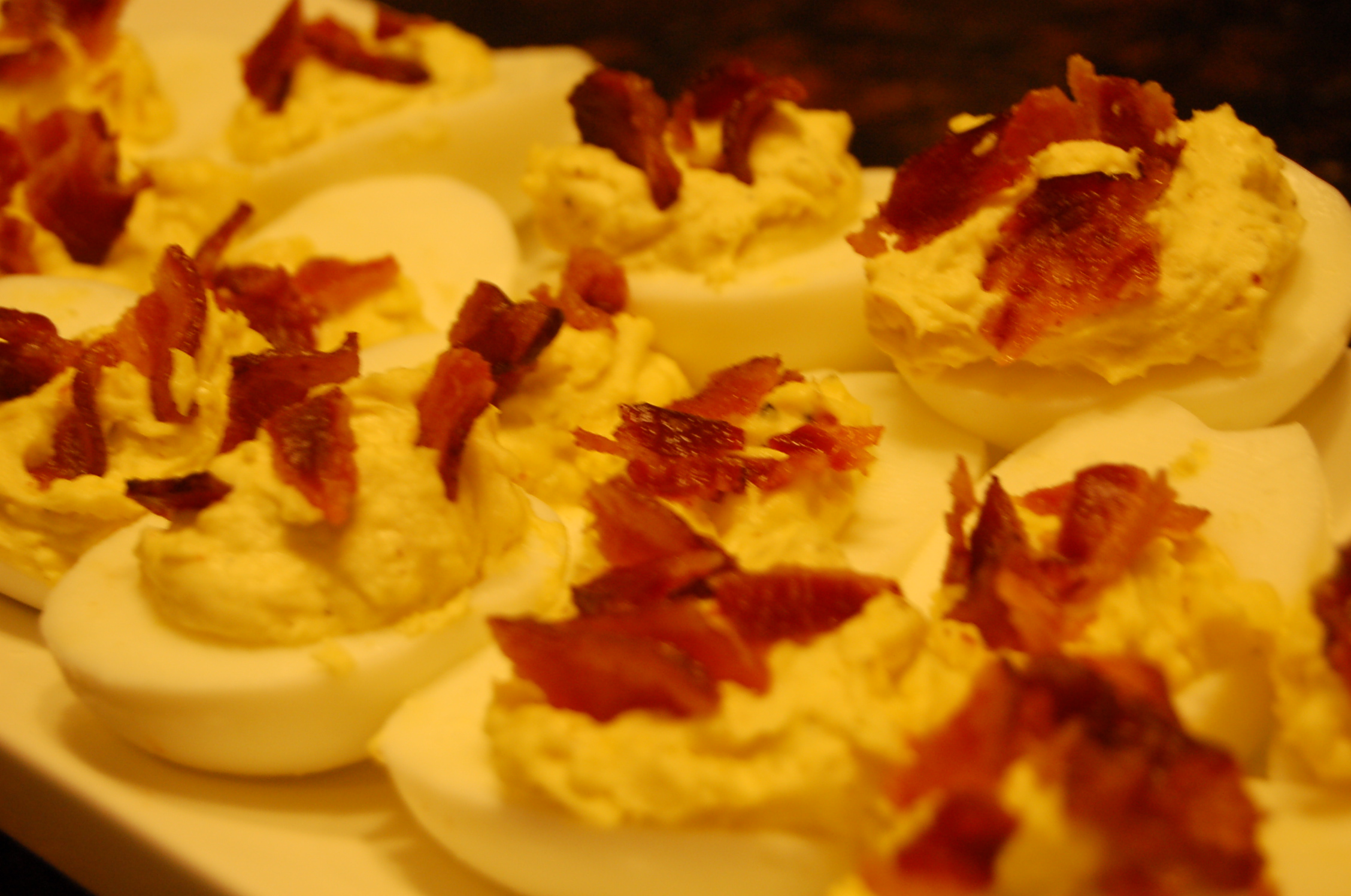 Stuffed Eggs topped with Crispy Bacon                           