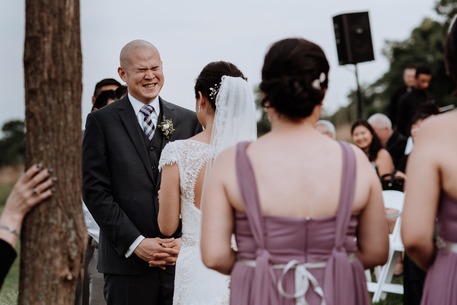 groom laughs during wedding cereomny