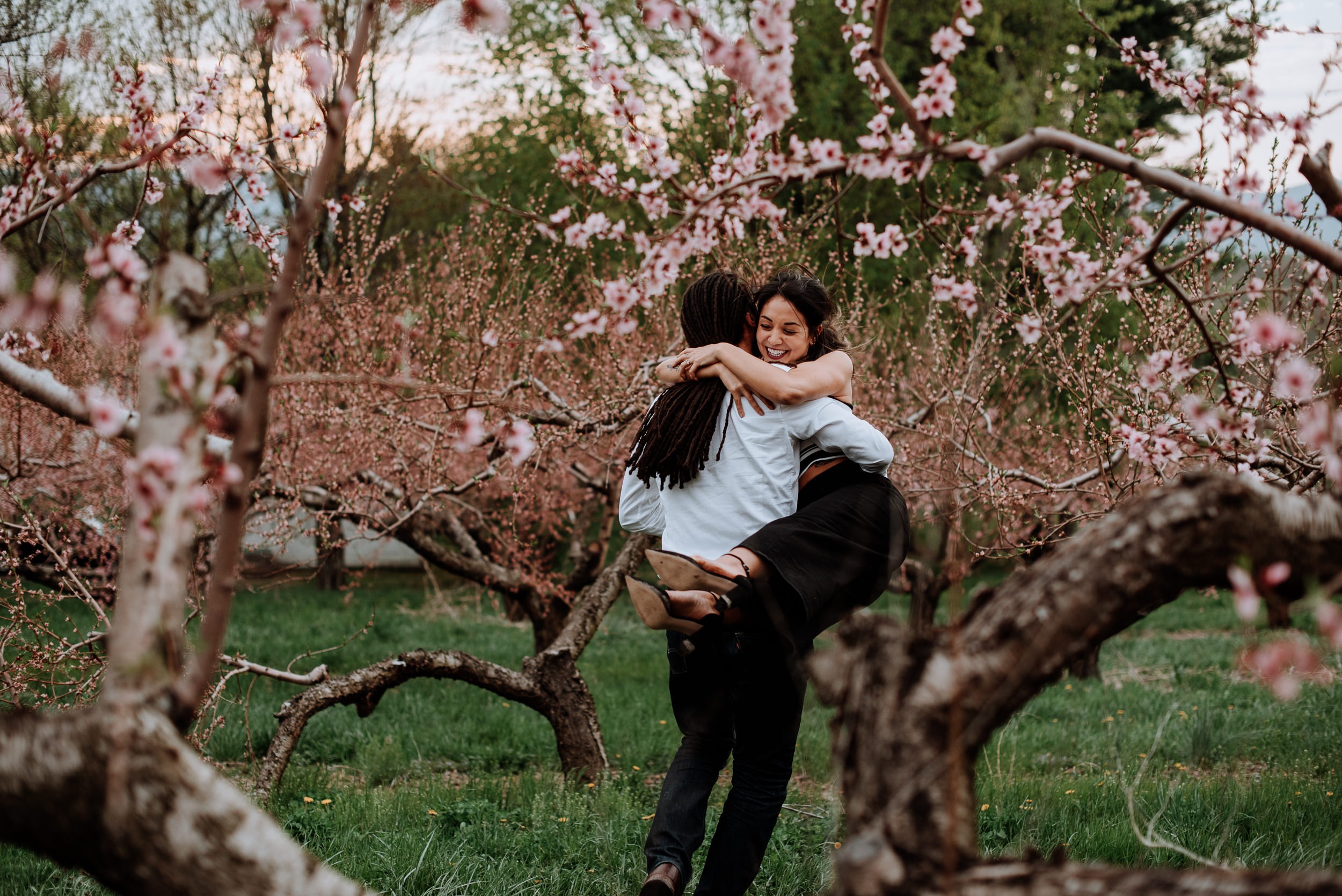 Hudson Valley Engagement session with apple blossoms, mountain v