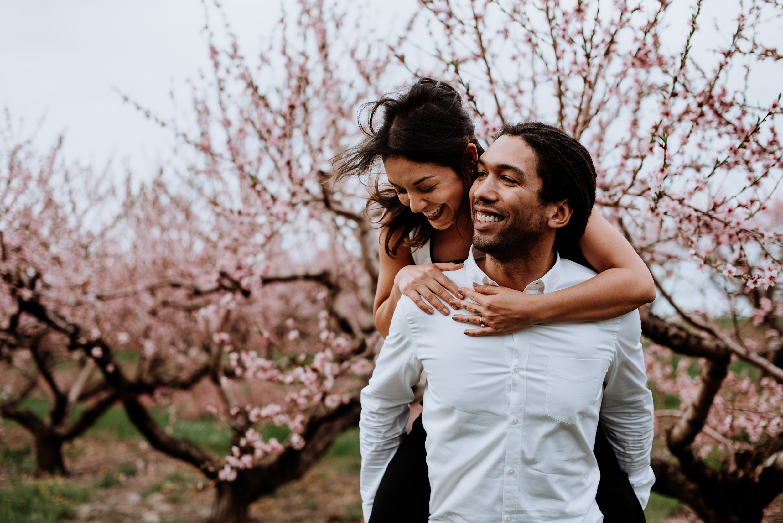 Hudson Valley Engagement session with apple blossoms, mountain v