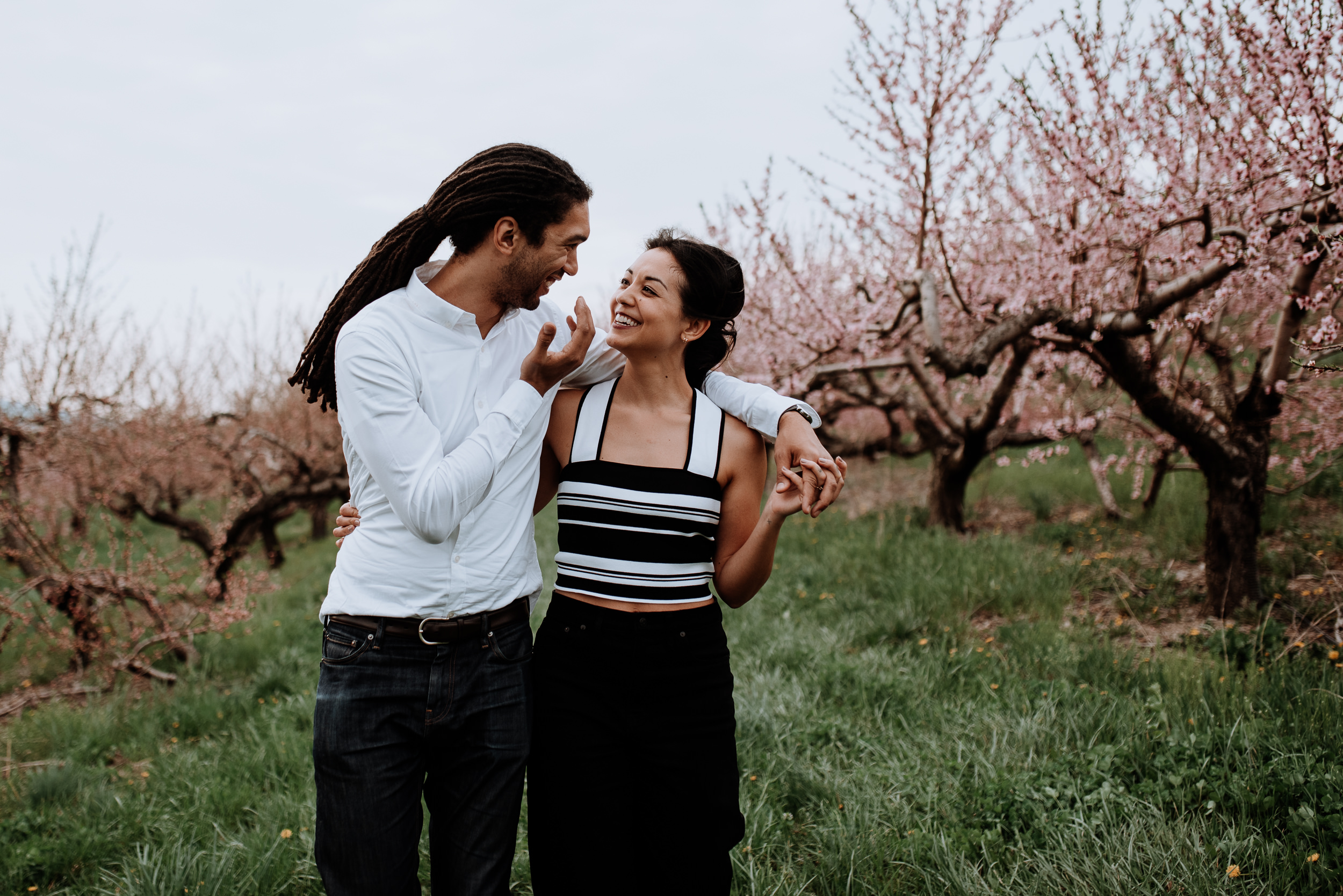 Hudson Valley Engagement session with apple blossoms, mountain v