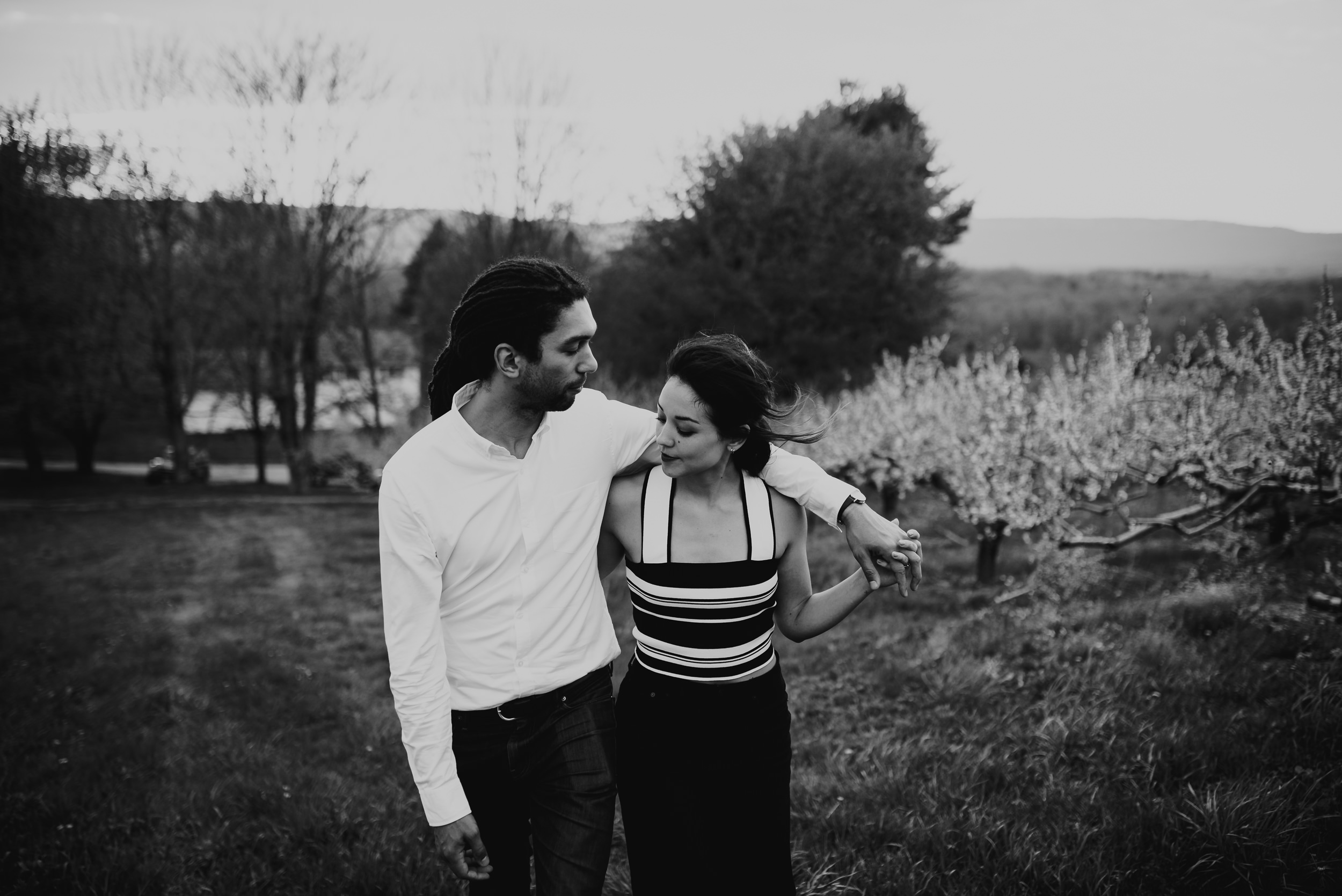 Hudson Valley Engagement session with apple blossoms, mountain v