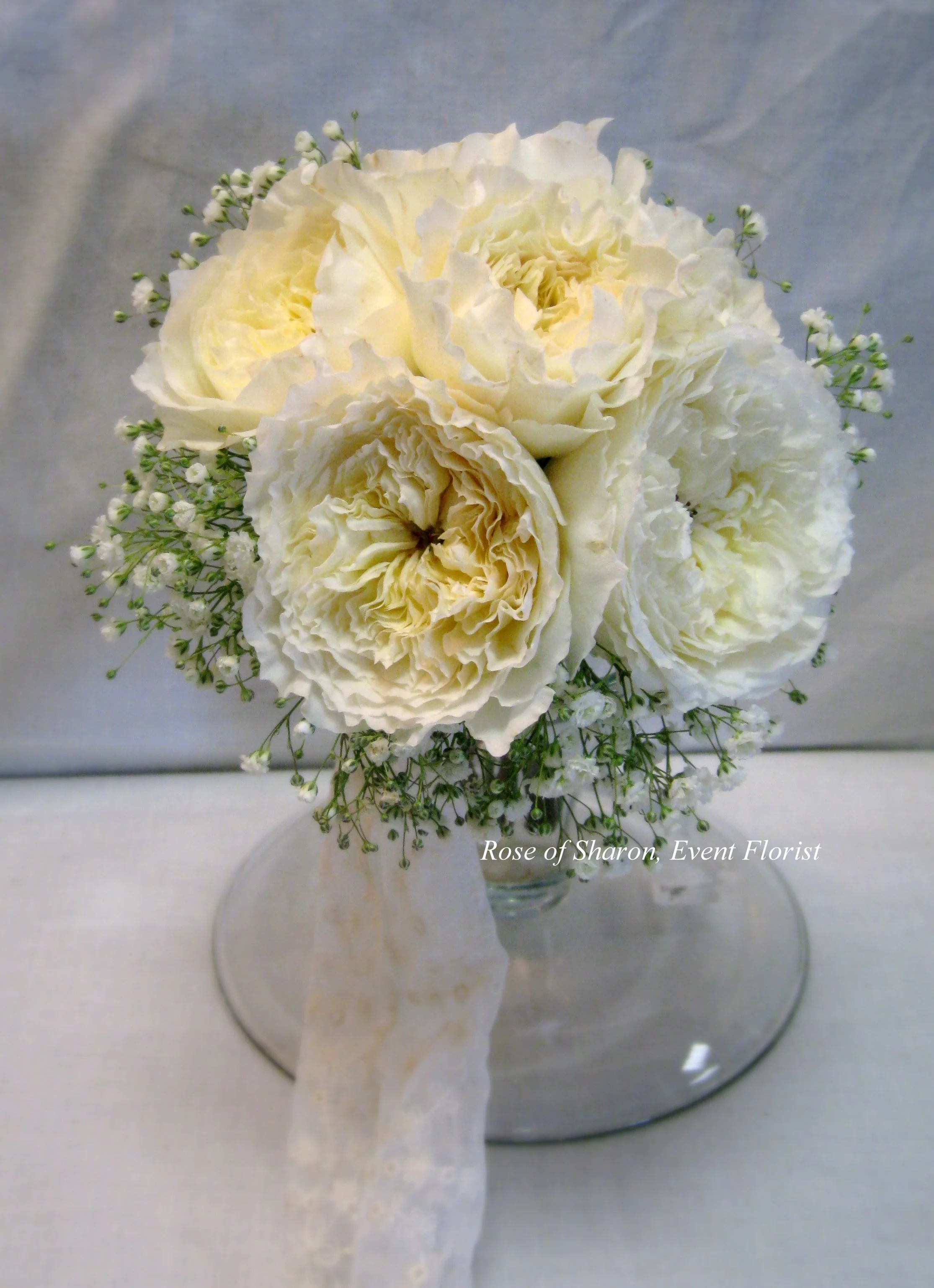 Hand-Tied Bouquet. White Garden Roses and Baby's Breath. Rose of Sharon Floral Designs