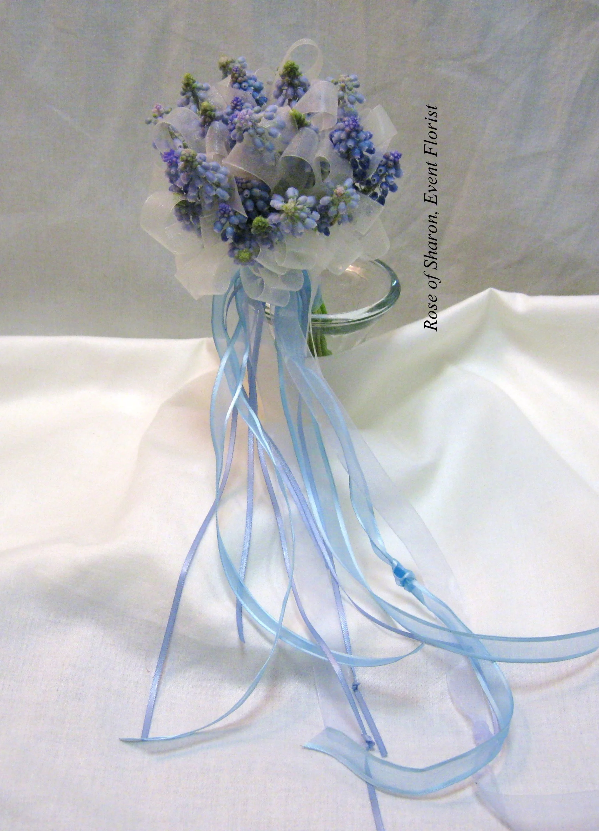 Blue Hand-Tied Grape Hyacinth Bouquet with Ribbon Accents. Rose of Sharon Floral Designs