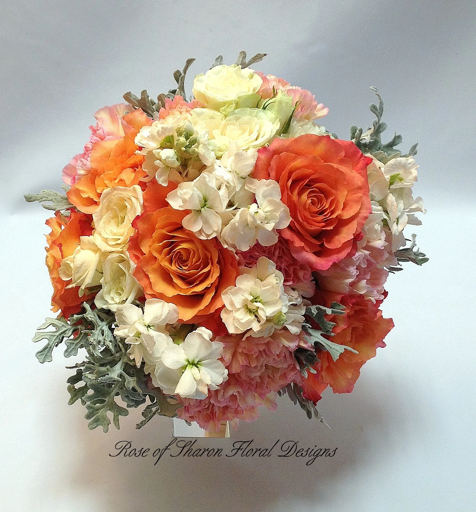 Orange and Cream Hand-Tied Bouquet with Spray Roses, Free Spirit Roses, Carnations and Stock. Rose of Sharon Floral Designs