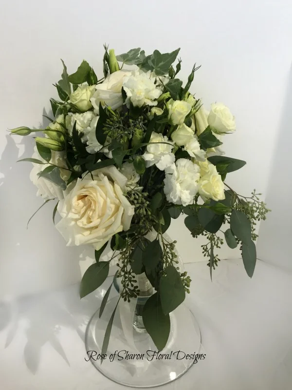 Natural Cascading Bouquet. White garden roses, spray roses, ranunculus & eucalyptus. Rose of Sharon Floral Designs