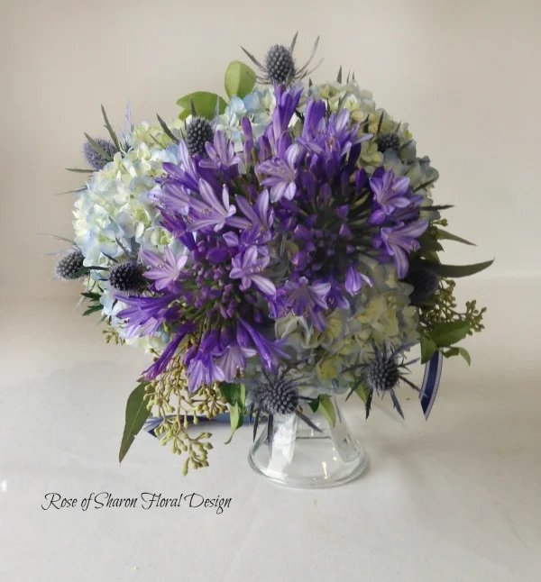 Blue Hand-Tied Bouquet with Hydrangeas, Agapanthus, and Thistle. Rose of Sharon Floral Designs.
