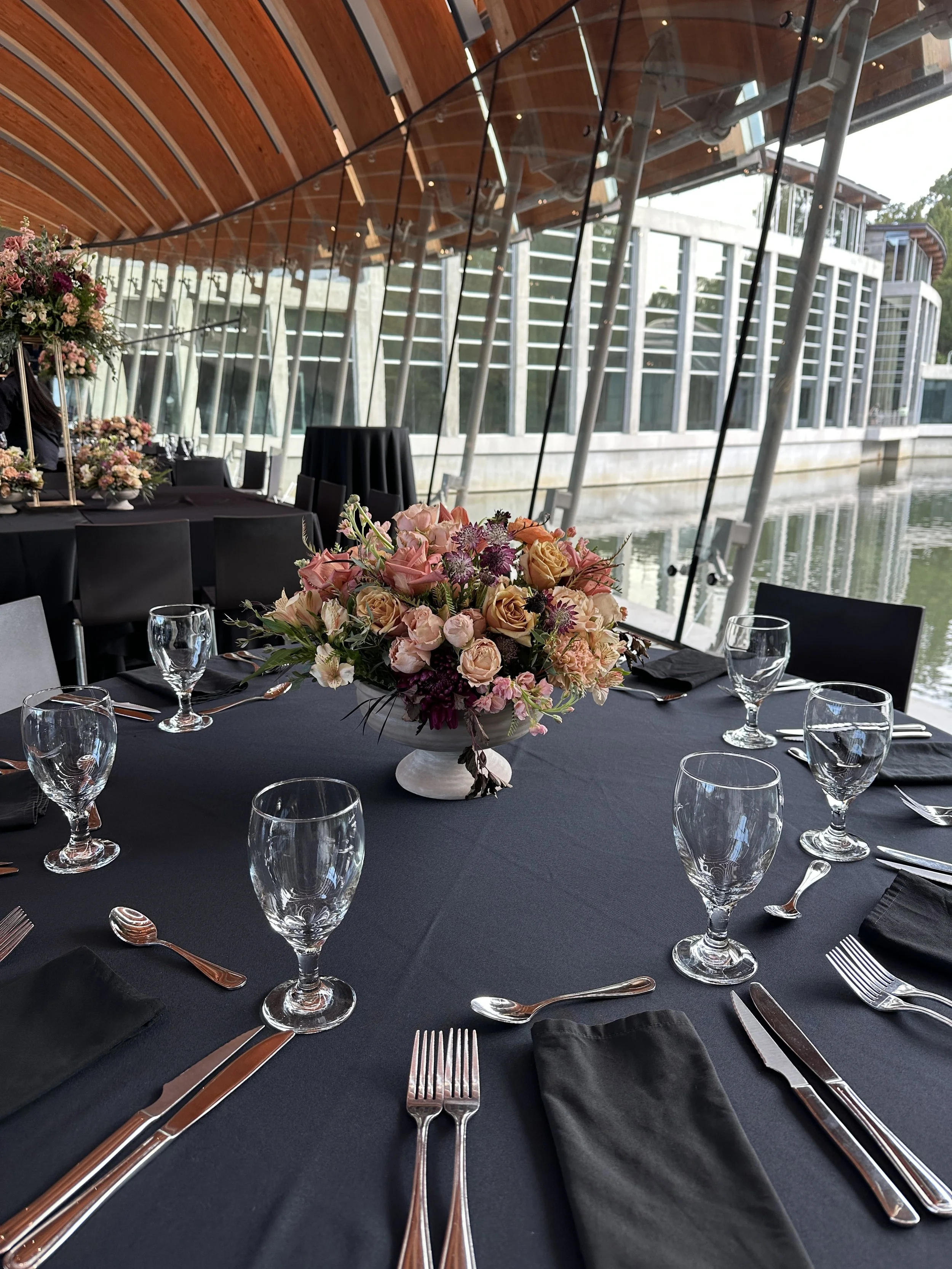 rose of sharon floral design studio corporate event flowers crystal bridges university of arkansas conference arrangements and centerpieces with peach and plum flowers compote lush design