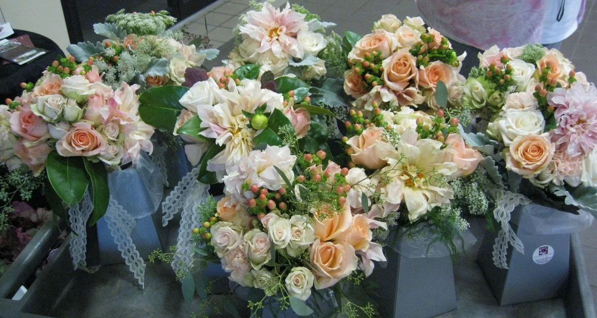 Wedding flowers by Rose of Sharon Floral Design Studio. Bridal bouquet with soft pastel roses, carnations, and Queen Anne’s Lace.