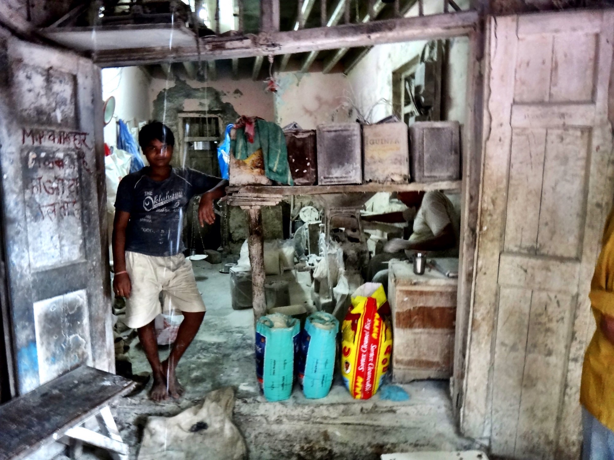 A baker standing proudly by his office