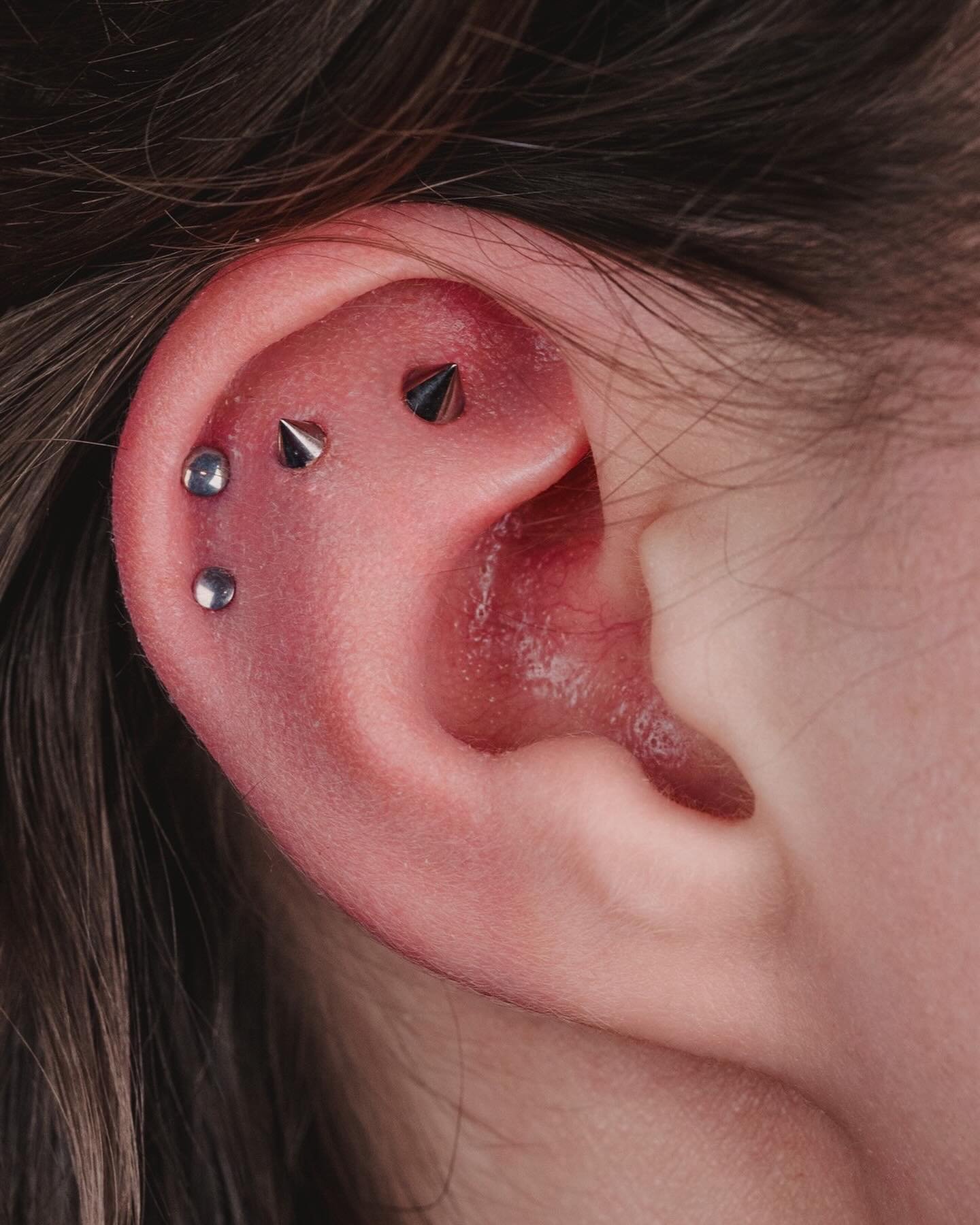 BEYOND⛓️&zwj;💥
 
YOUR REACH 
 
This titanium setup is coming along nicely for Abigail, with two fresh outer helix piercings with some classic disks and two healing flats with some threaded spikes! All performed by William⚔️
⠀⠀⠀⠀⠀⠀⠀⠀⠀
~  @passenger.p