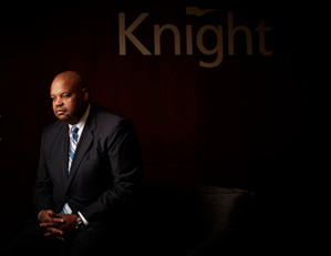 executive at a global financial services firm -taking an opportunity to integrate his company's Brand into his portrait.