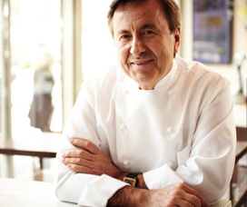 Chef Daniel Boulud at Epicerie Boulud - light and airy, dressed in a Chef's Coat