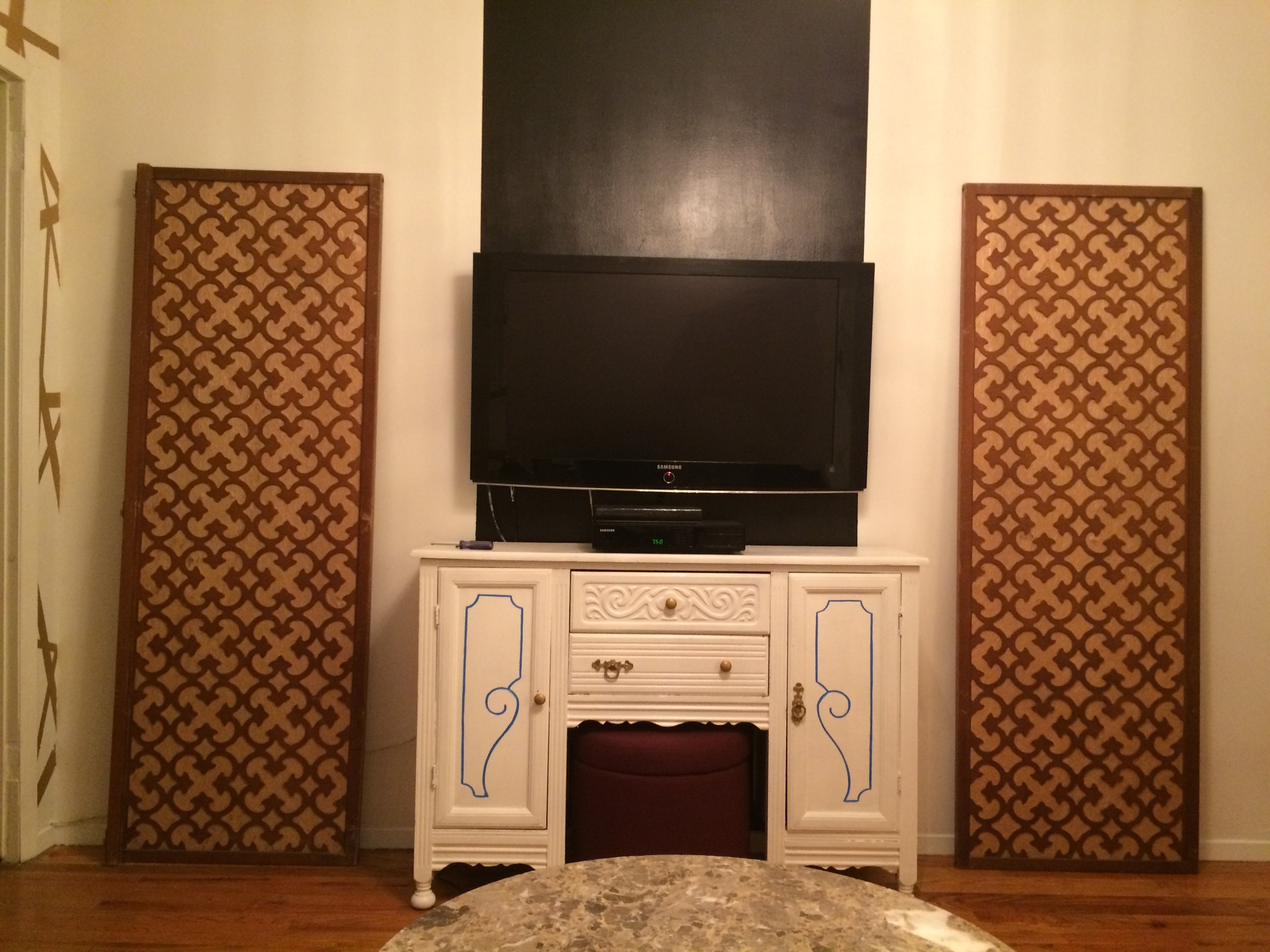 That tv stand is all kinds of wrong, y'all, but she's been PJ DIY'd since this pic