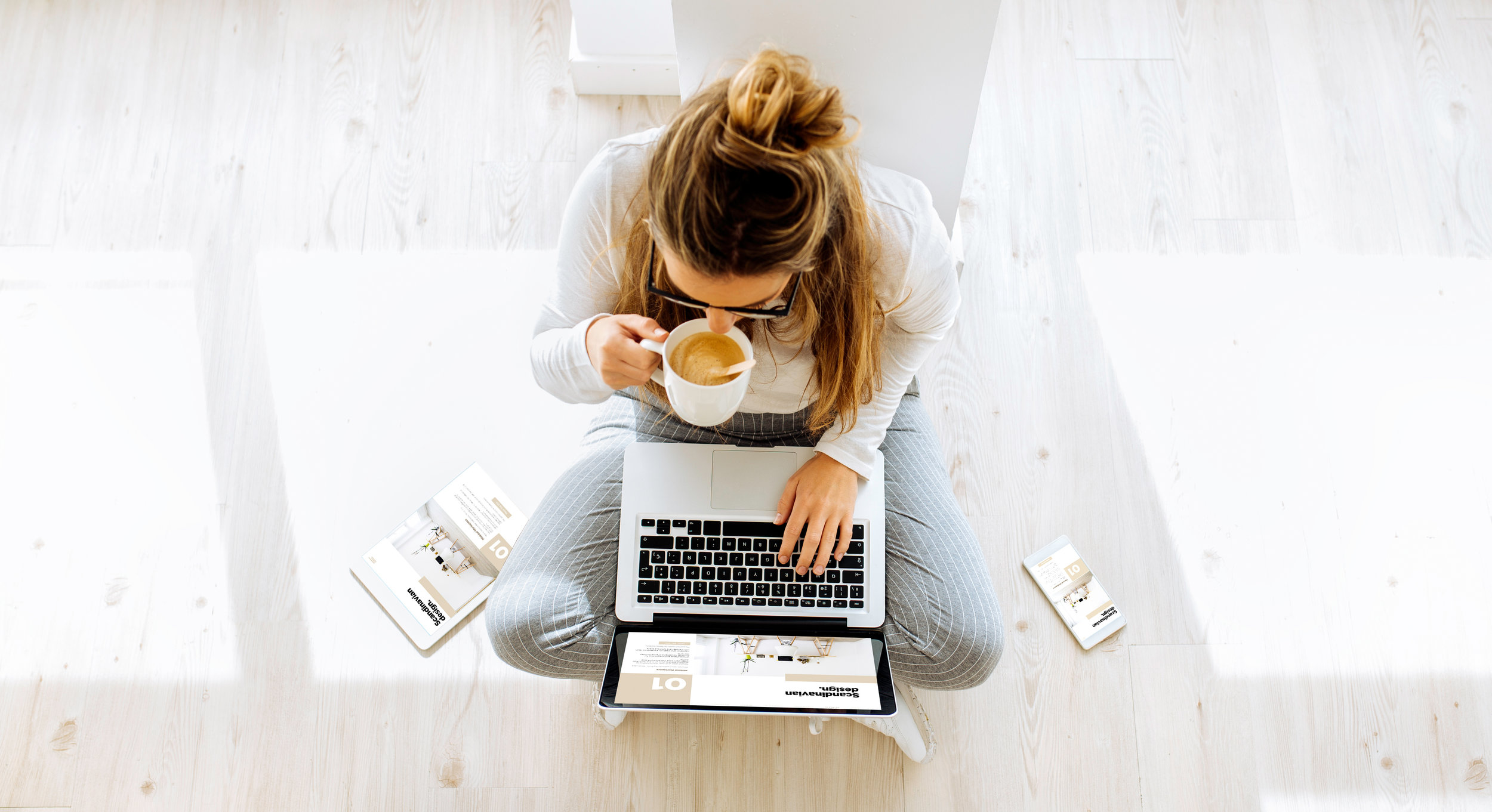 top view of woman working on responsive website scandinavian blog
