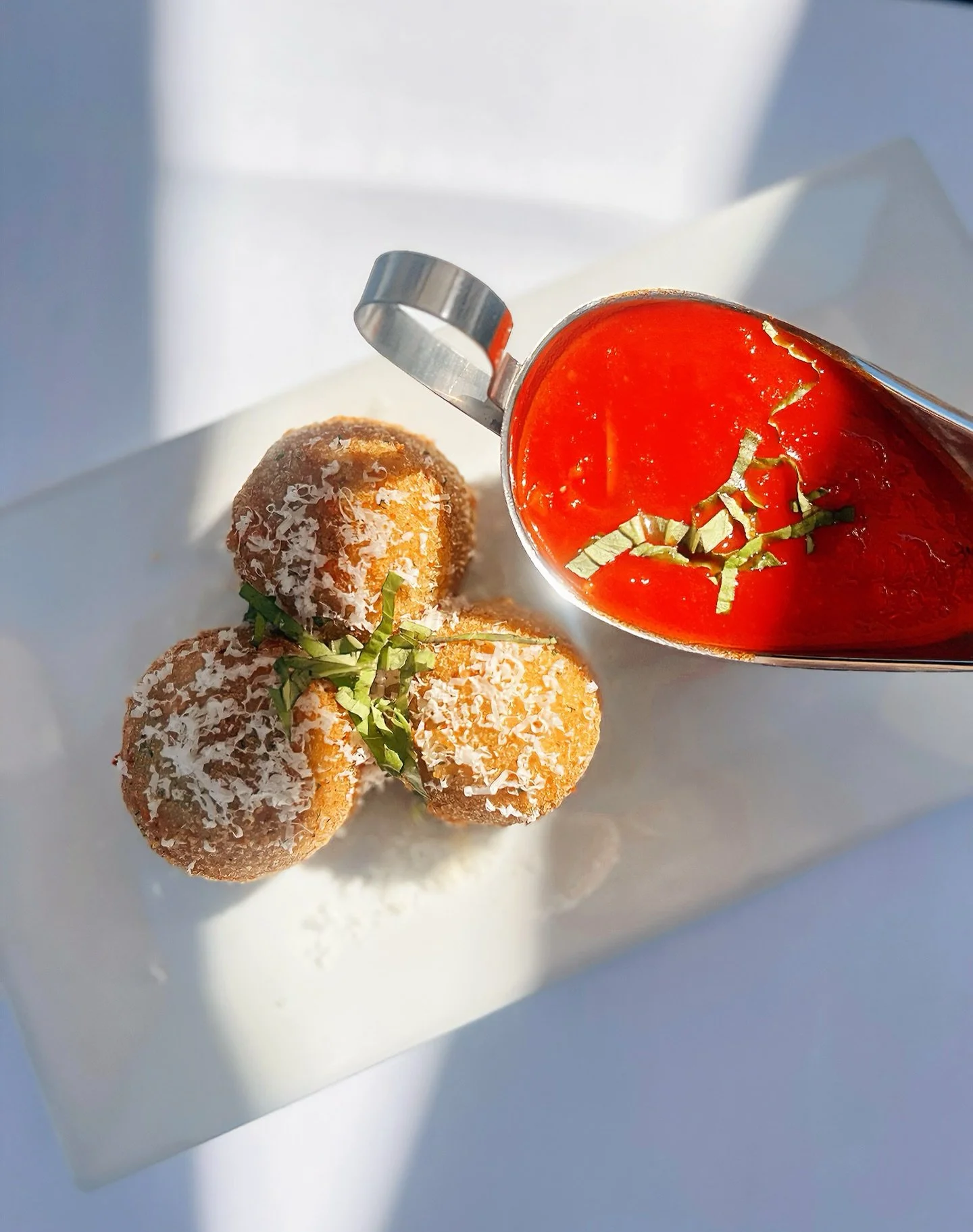 Oggi alla Trattoria Vivolo 

Delight in our Arancini Ripieni - golden polpette di risotto filled with funghi porcini, piselli dolci, and creamy formaggio fontina.
Served hot with a rich salsa marinara, each bite is a perfect taste of comforto italian