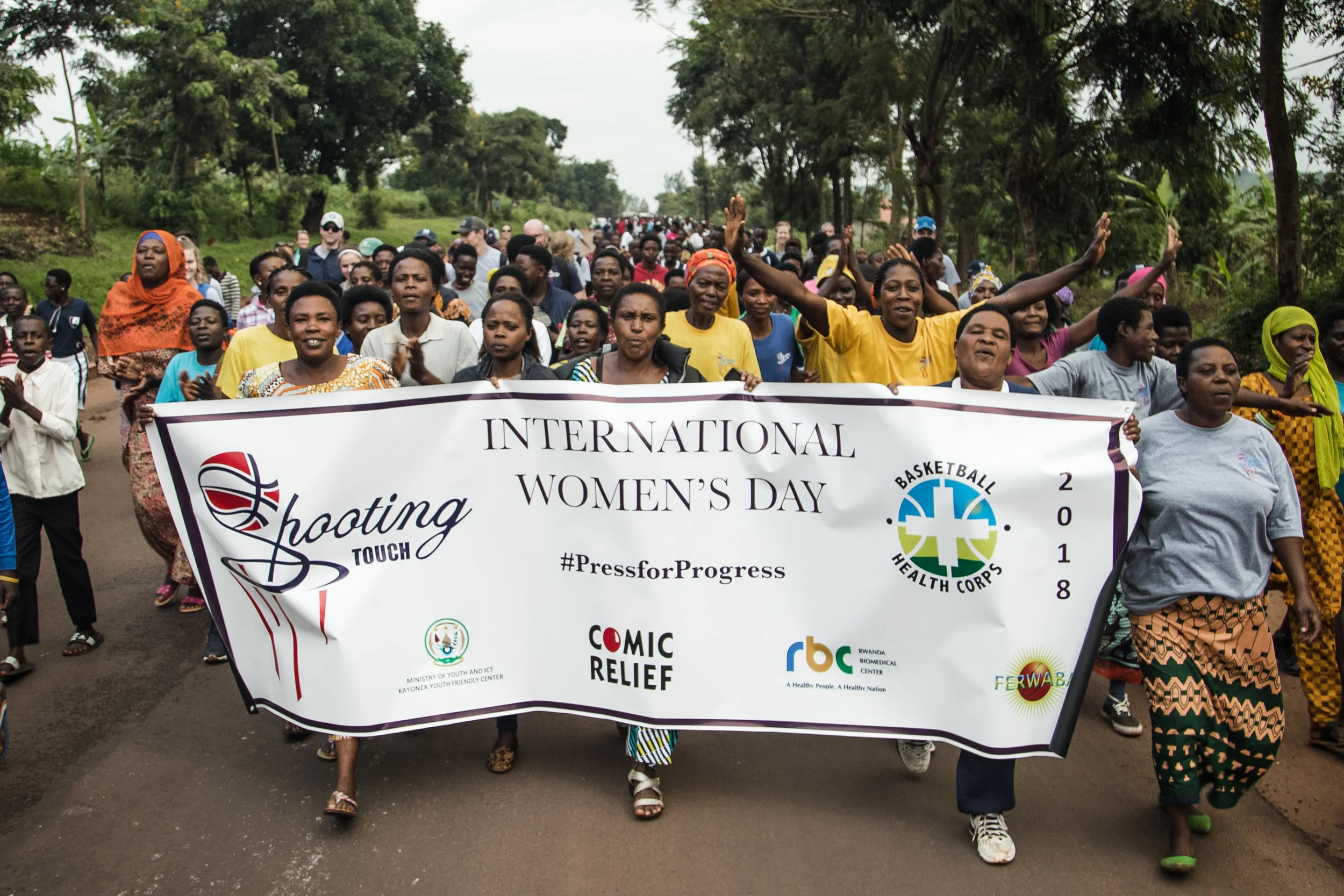 Over 1k people marched through the village of Nyamirama towards a basketball court to celebrate International Women's Day. 