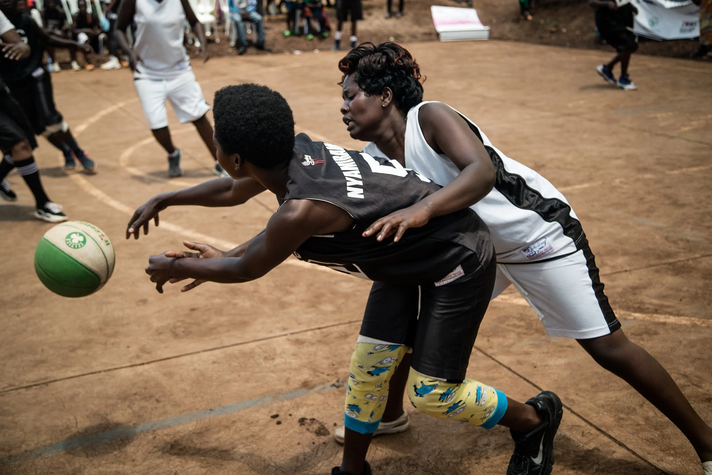 Two women fight for the ball during one of the women's games. 