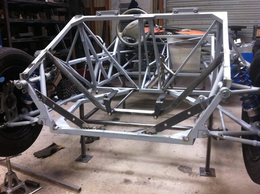 Temporary bracing holds suspension pickups while rear mounts are made