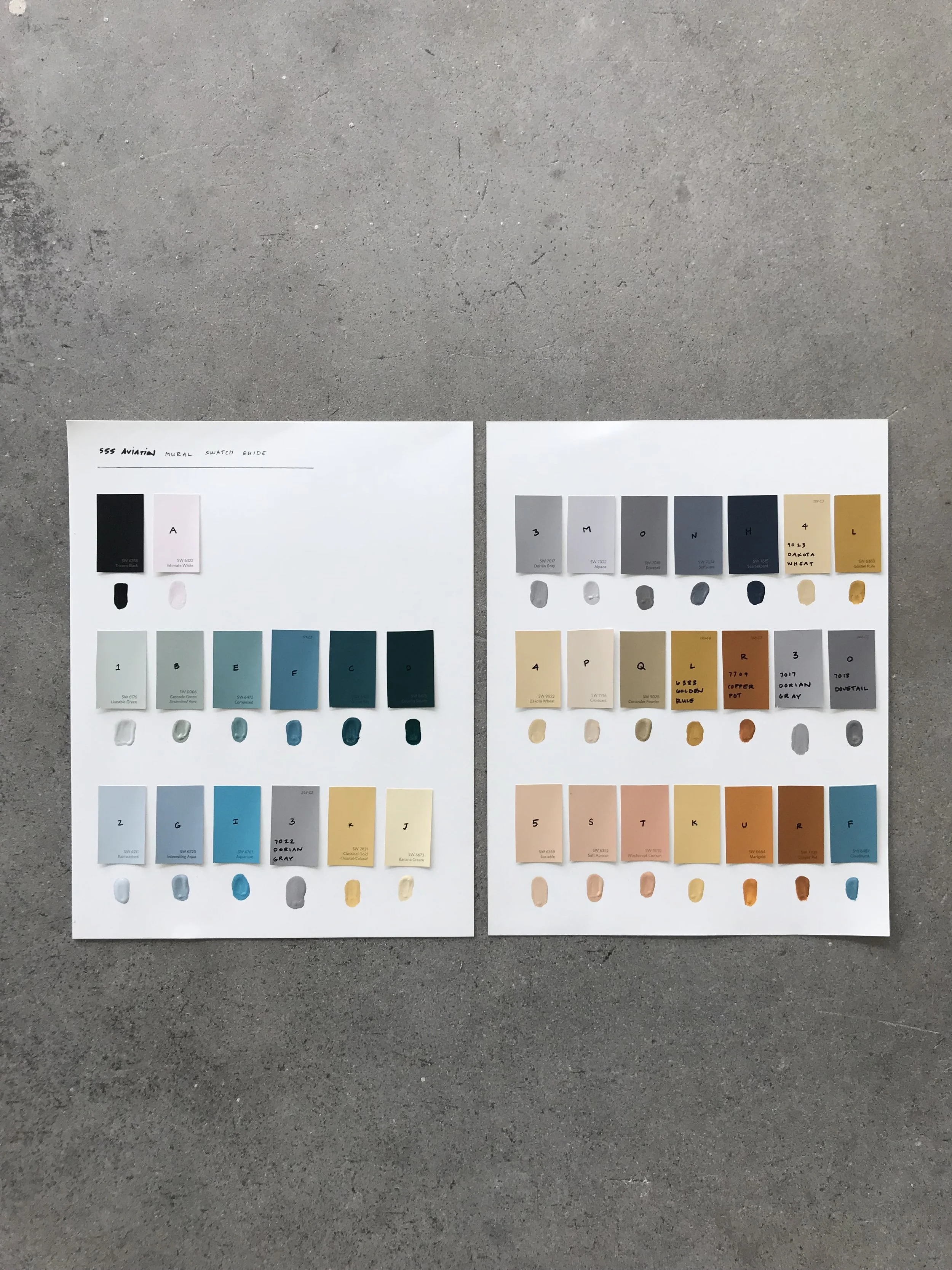 Ventura based muralist holds paint brushes for hand-painting murals.