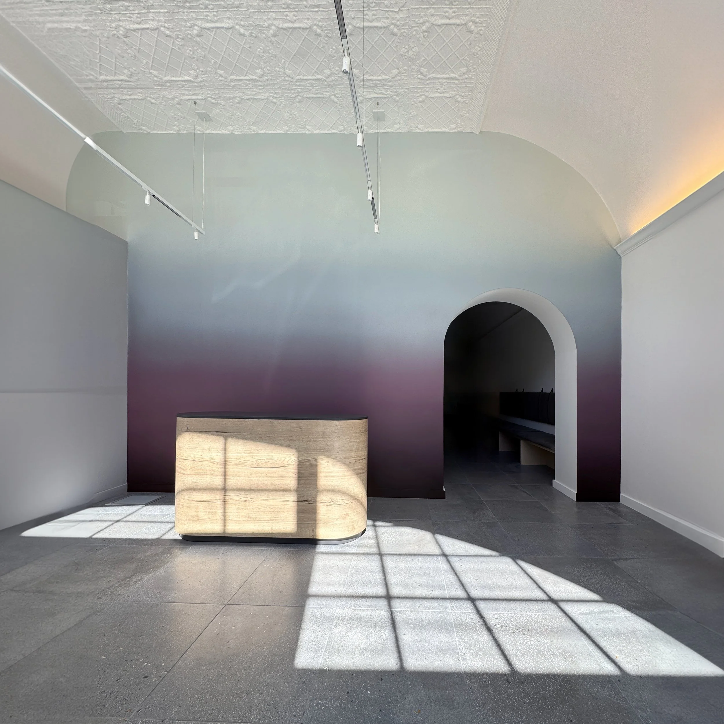 Hand-painted interior ombre mural fading from deep purple and plum at the bottom to a dusty blue gray at the top