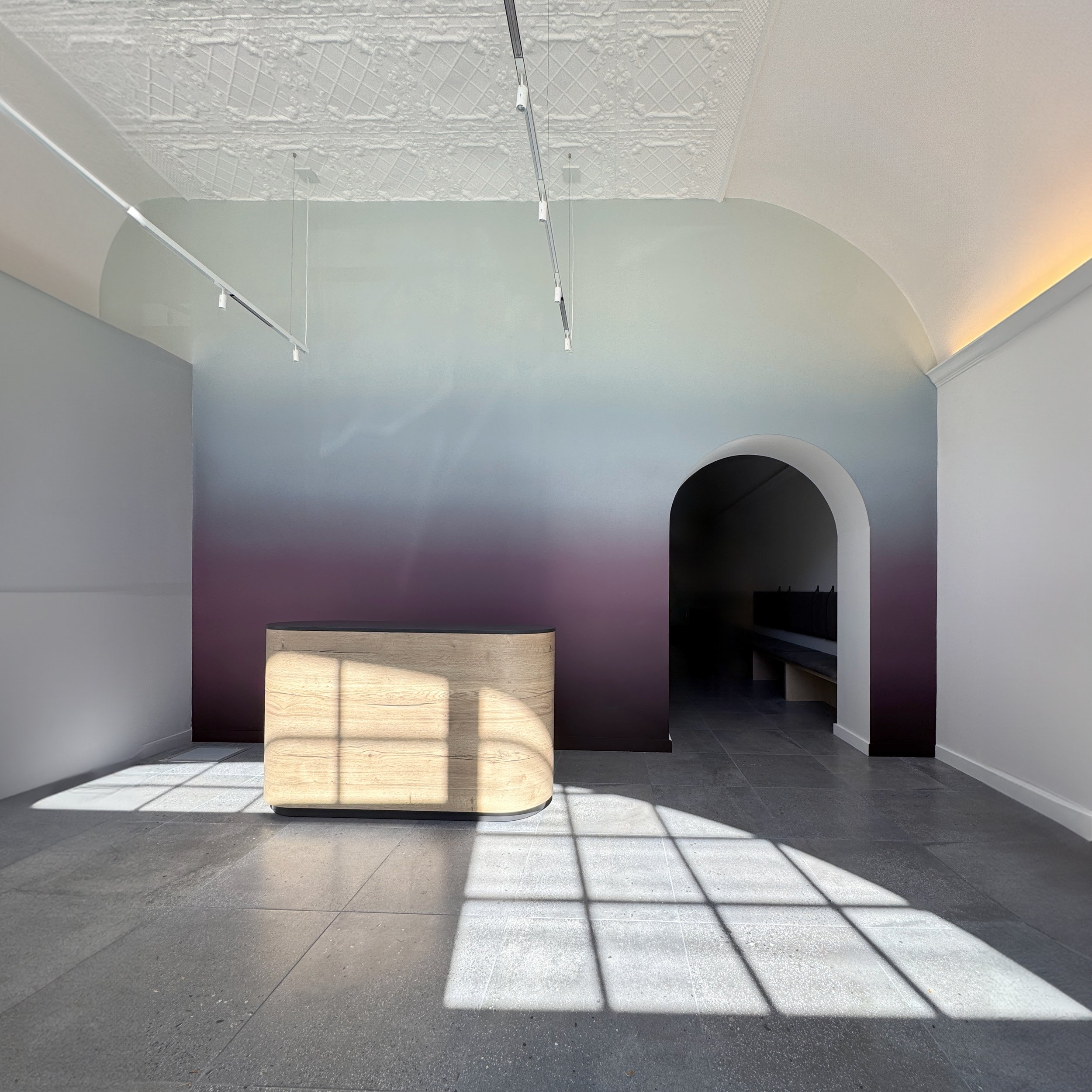 A soothing, smooth ombre effect, hand-painted on an interior wall of a yoga studio