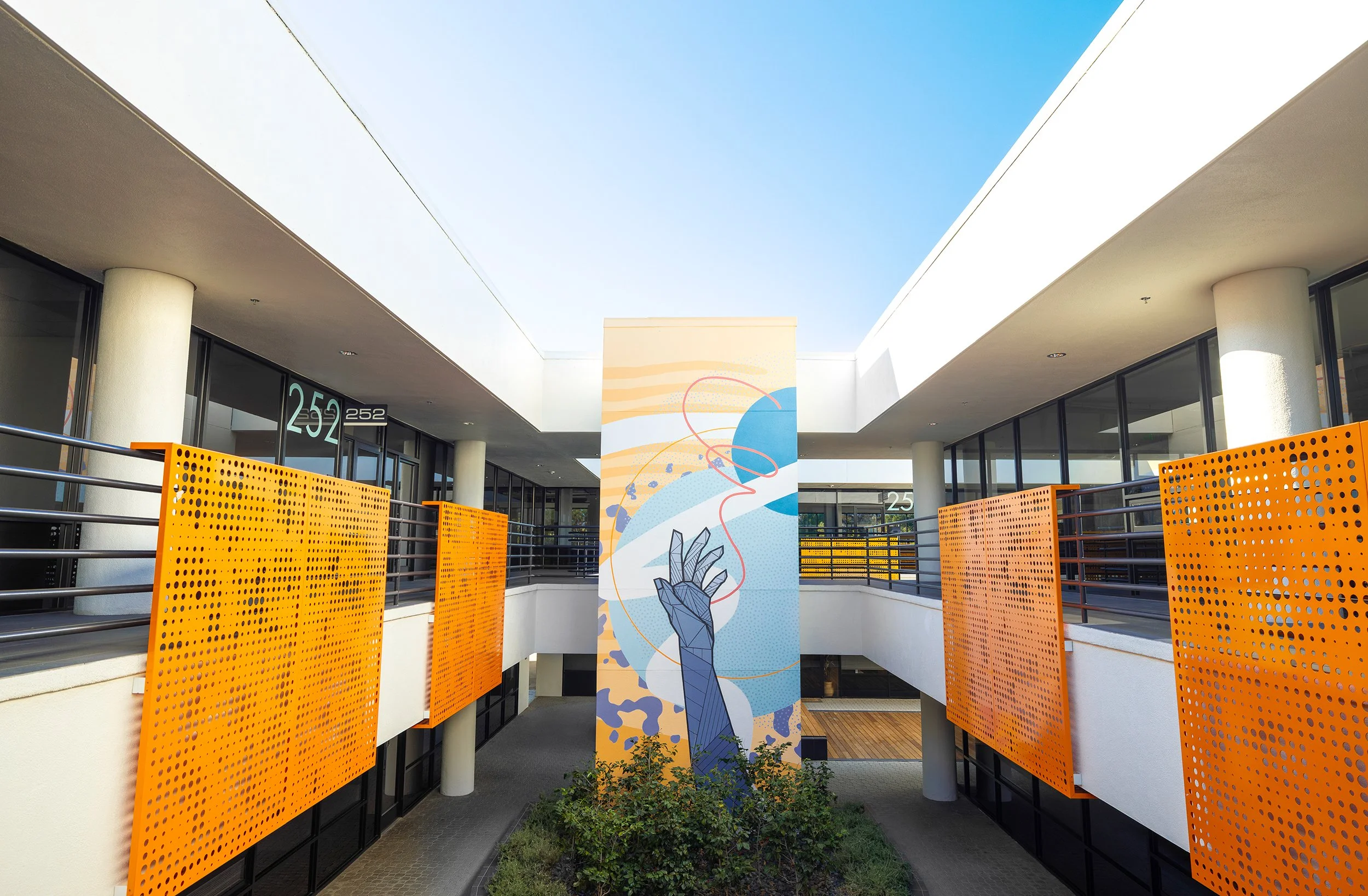 Hand painted exterior mural in a corporate courtyard by Allison Kunath.
