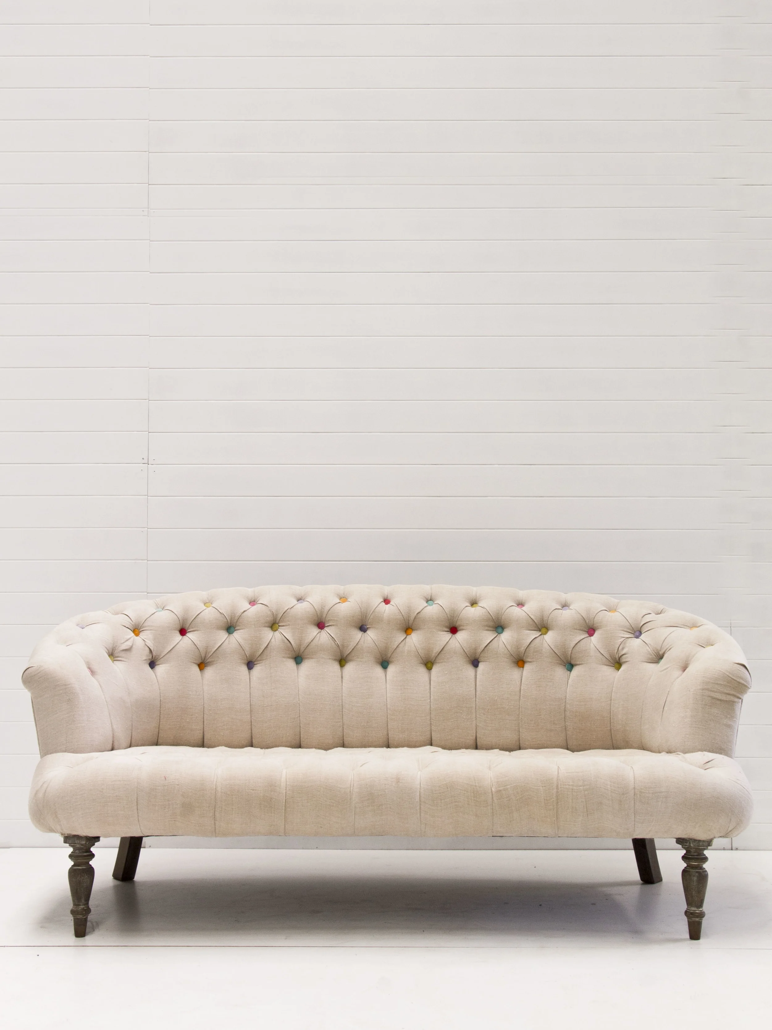 coloured button tufted sofa — Little Gray Station Wedding Styling