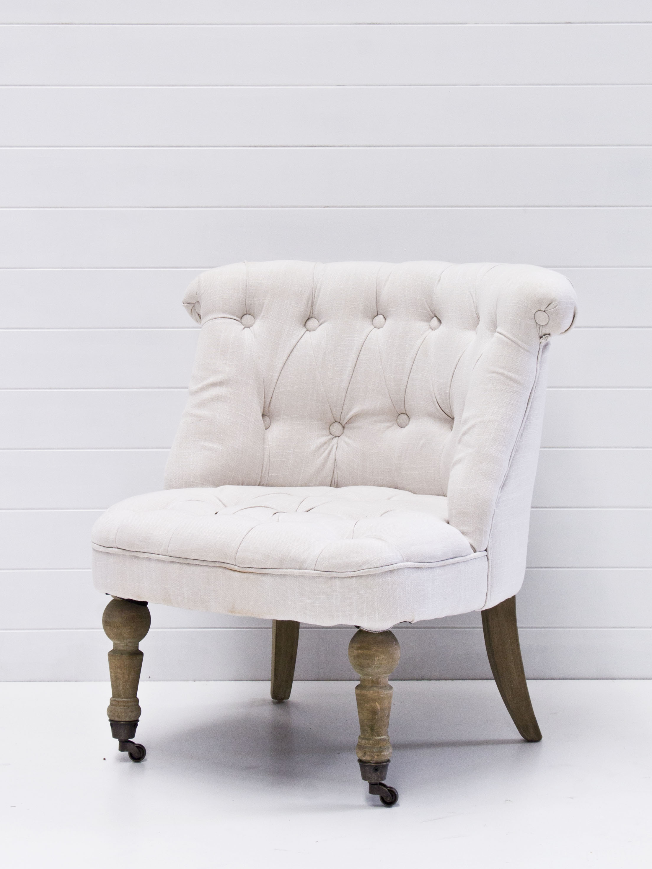 Petite linen tufted armchairs.jpg