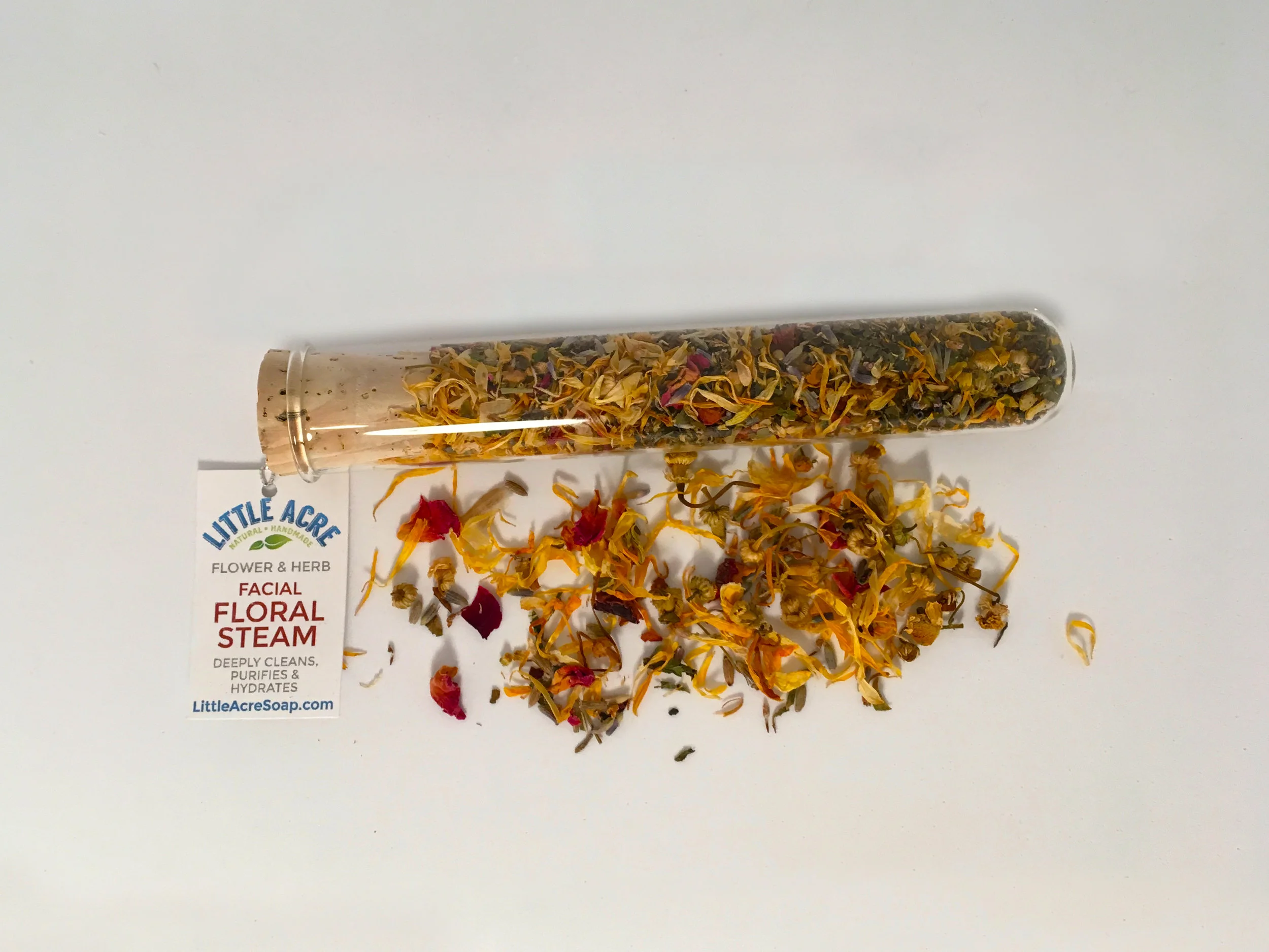 FACIAL FLORAL STEAM Treat your face to a nourishing steam with this blend of beneficial flowers. Deeply cleans your skin's pores and promotes hydration and purification. Simply stir contents into a large bowl of simmered water, lean over while covering head with a towel for 3 to 5 minutes. Follow with our Rose Clay Face Mask for best results. Comes in a great glass test tube with cork stopper. Contains Callendula Petals, Rose Petals, Lavender Buds, Chamomile Flowers, Peppermint Leaves, and Nettle Leaves. $4