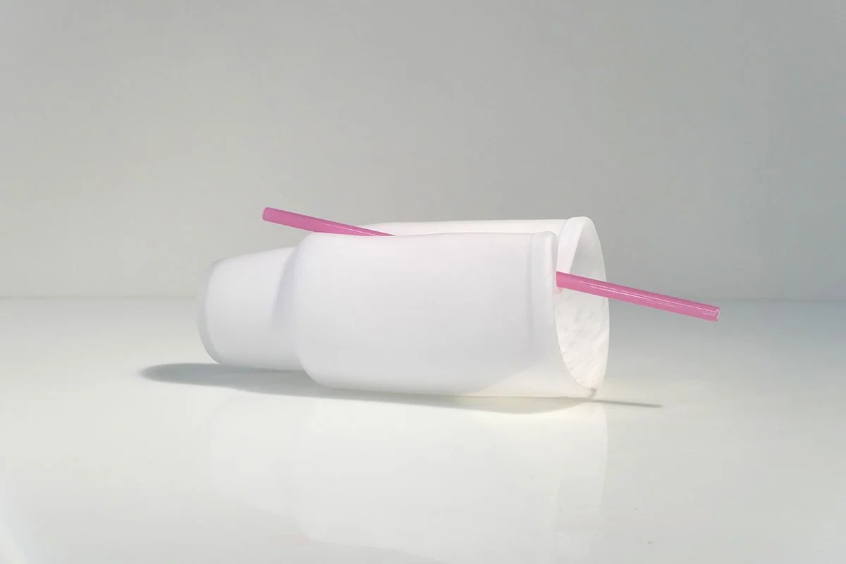 Pink straw in vertical crease of partically squished cup_01.jpg
