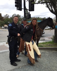 Officer Michael adds a little humor by pretending to handcuff Megan and arrest her for disorderly conduct. 
