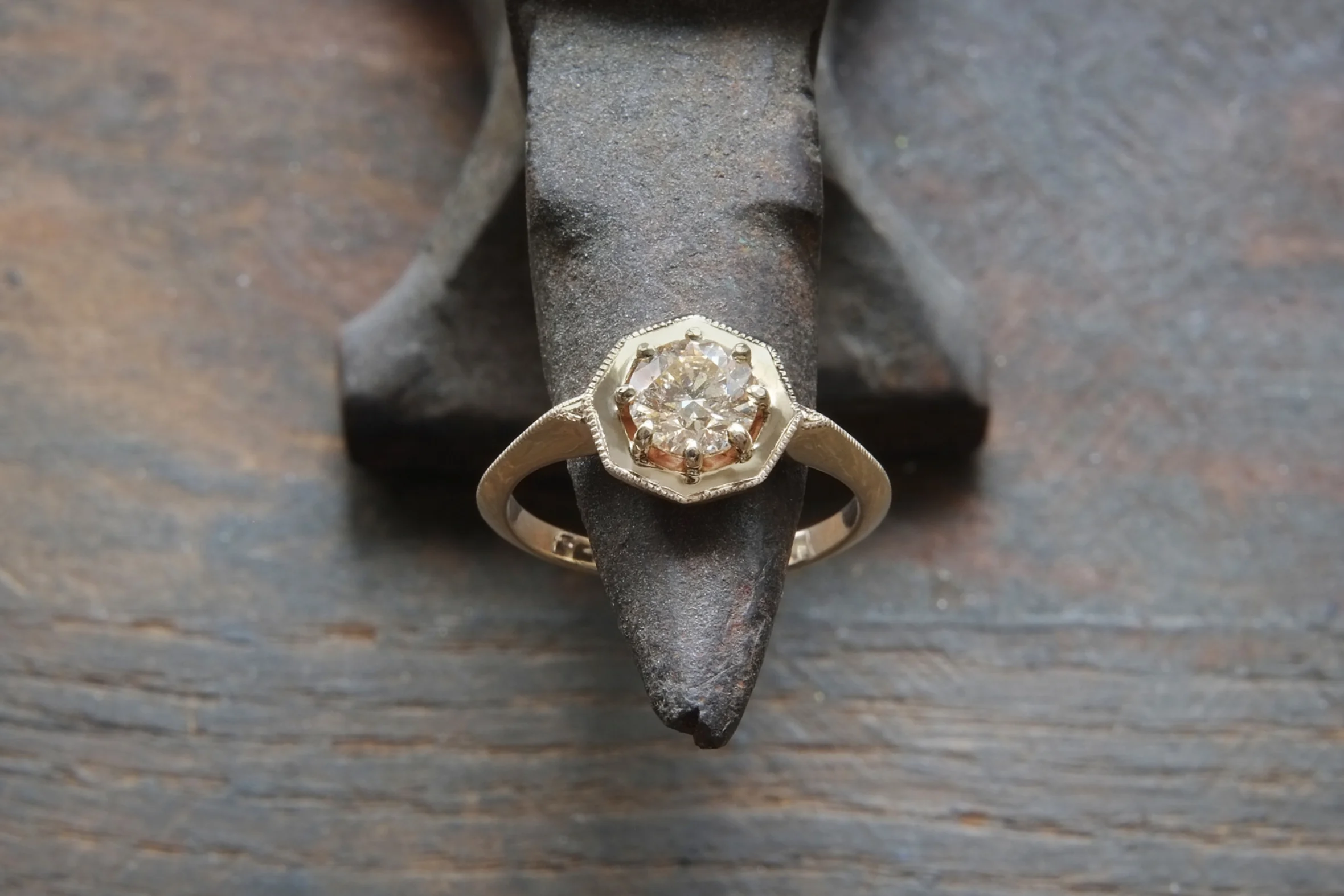 Custom carved, hand engraved 14k yellow gold octagonal engagement ring with a gorgeous .76ct champagne diamond