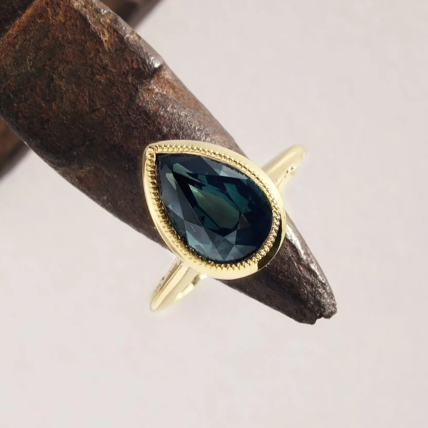 3ct pear cut sapphire in 18k gold