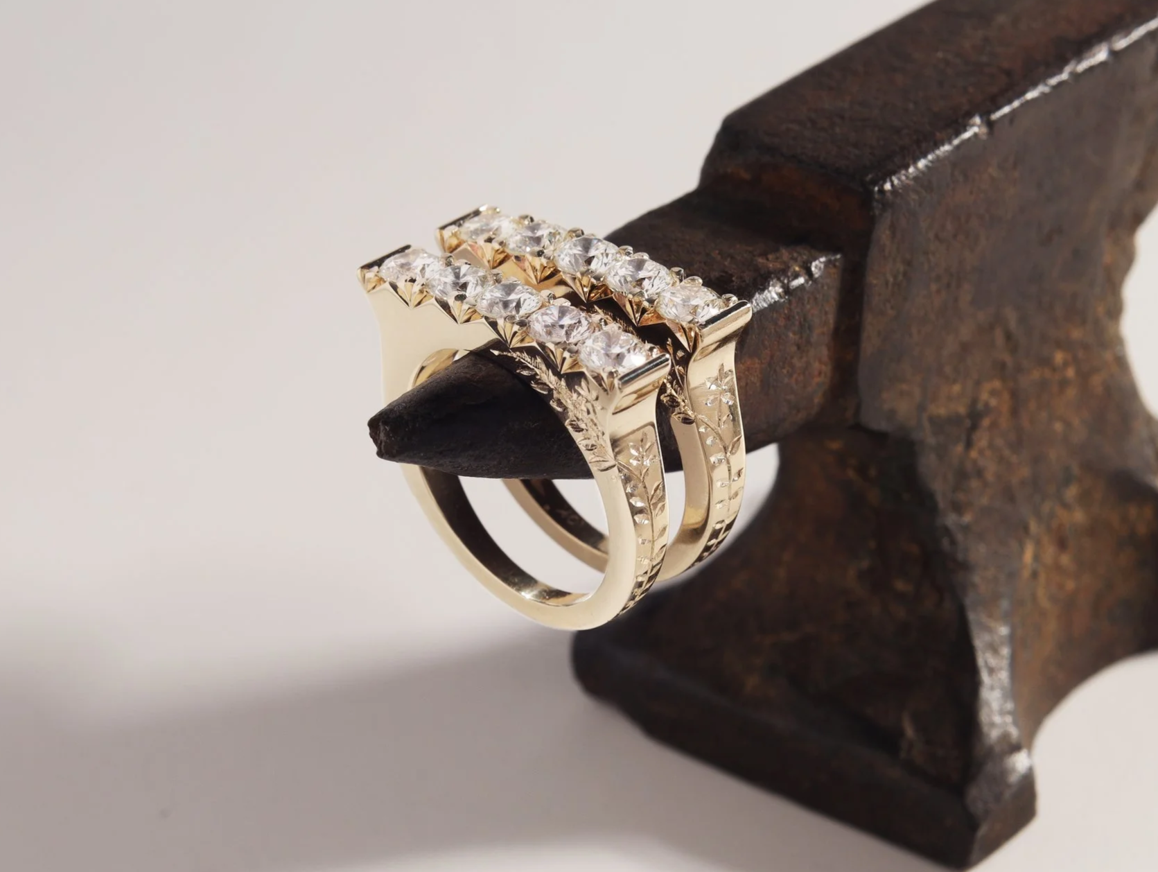 Custom made, matching white diamond rings with hand engraving.