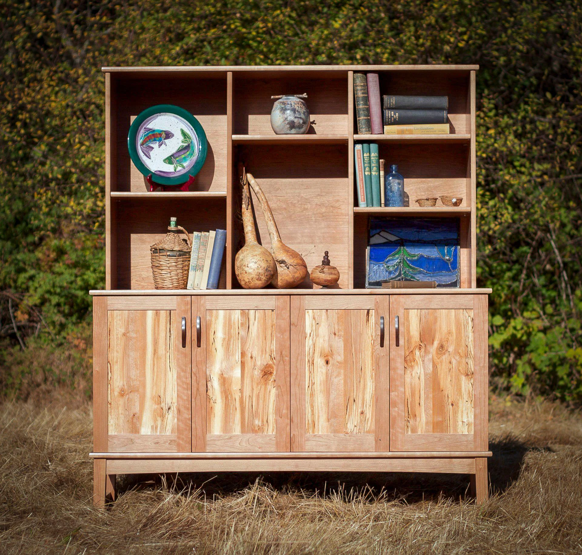 Cherry display cabinet with spalted alder door panels.