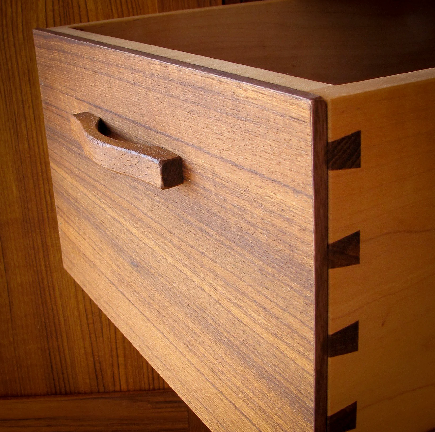 Dovetailed teak drawer with custom pull.
