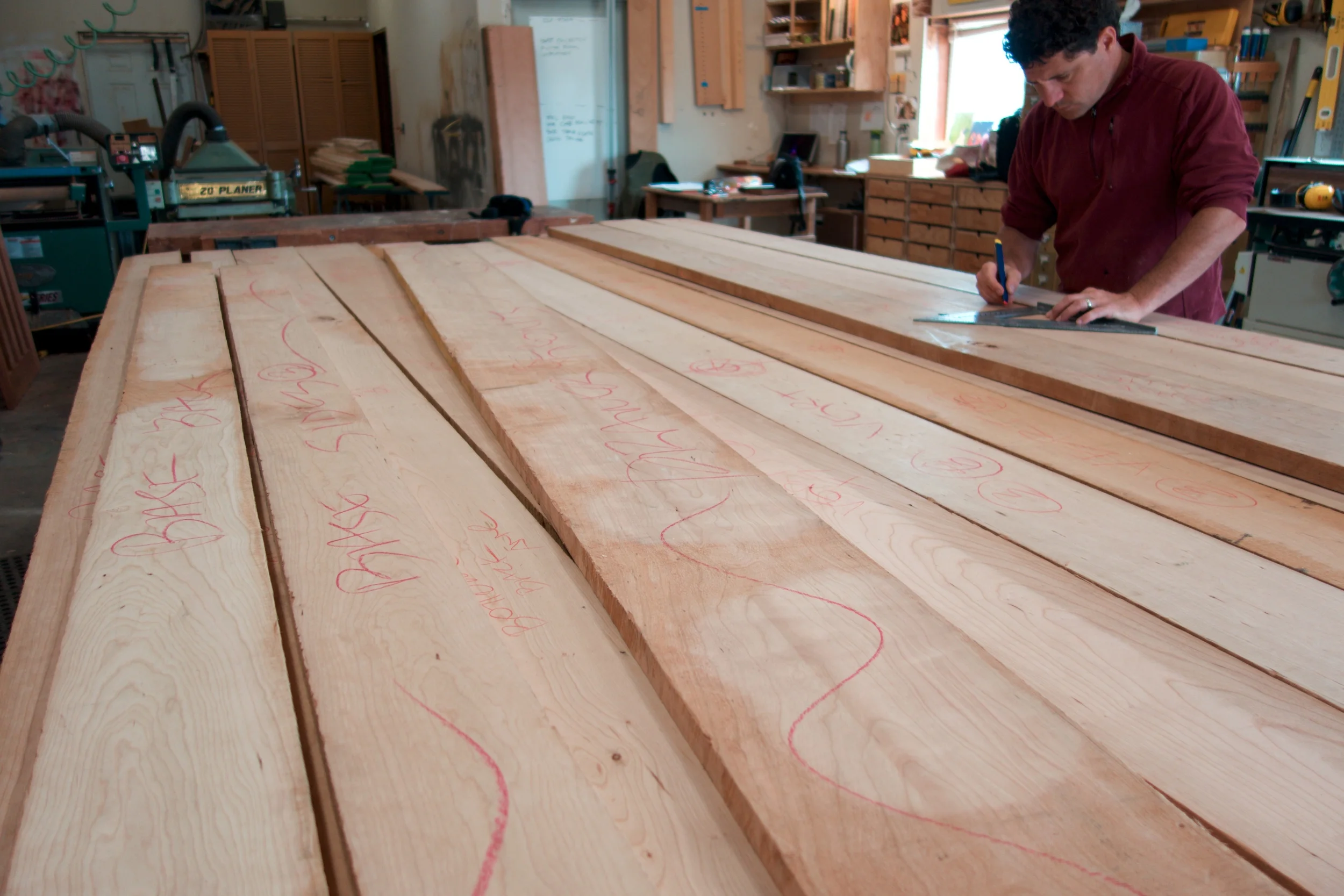 Lots of rough sawn domestic cherry and quilted western maple in the shop. Now it's time to figure out how best to slice and dice all these beautiful boards into parts for the armoires. 