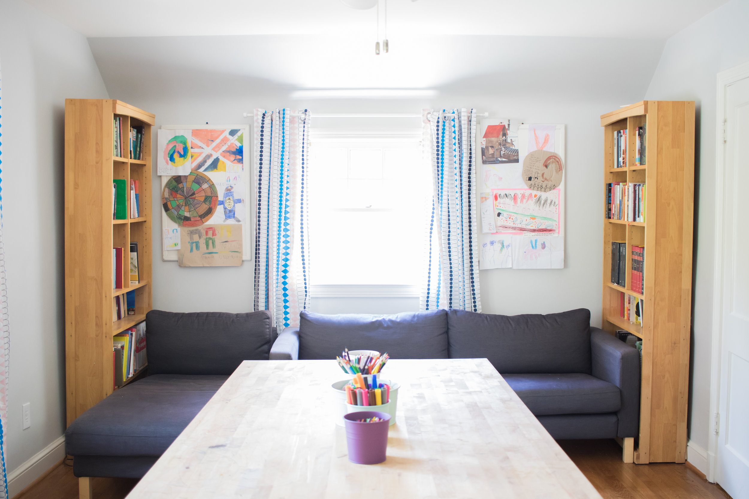 So much of this room is IKEA... again. I think everything in the room except the blonde bookshelves and white chairs are from IKEA. 