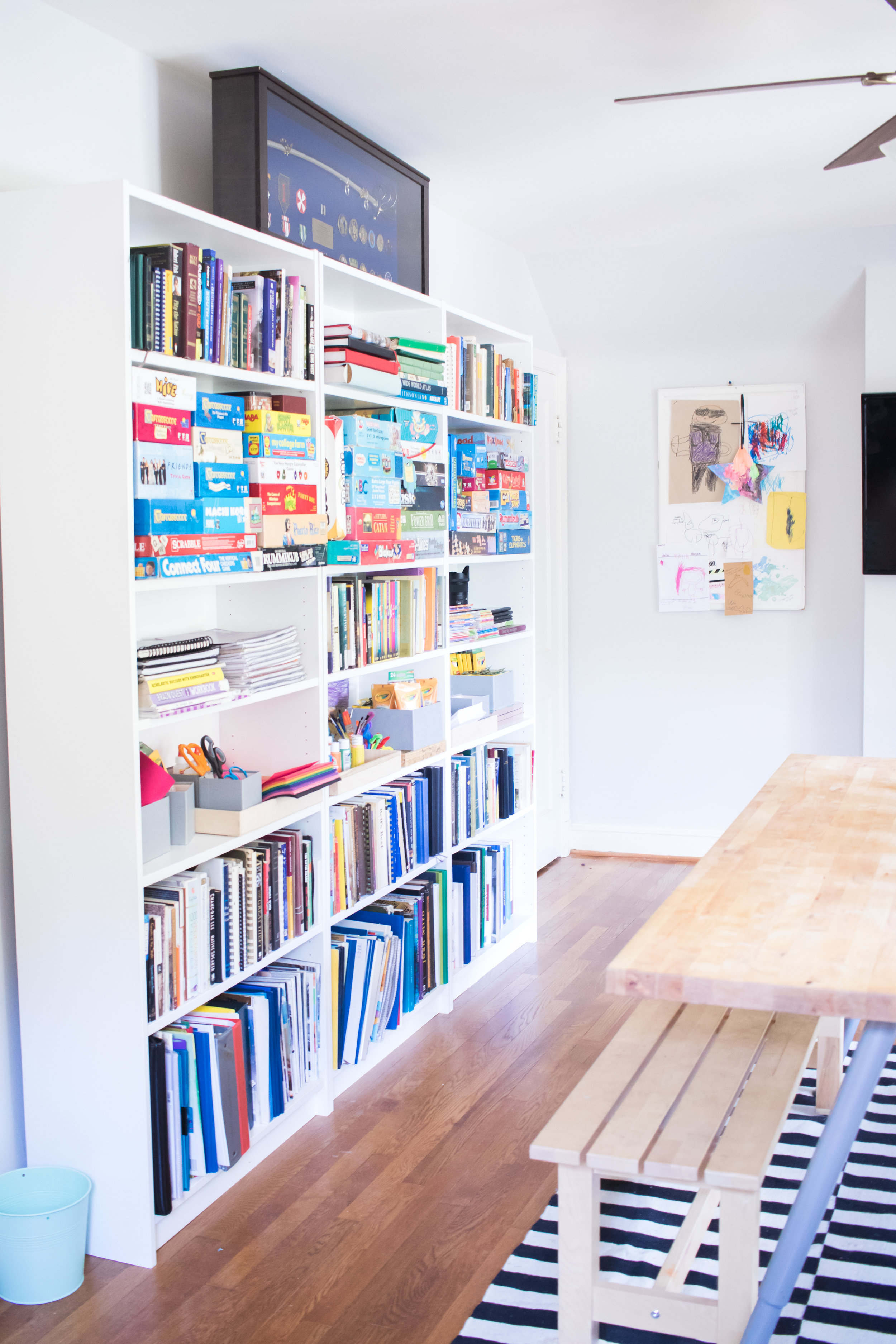 This is also where we play games. Game night anyone? Ritter's cool military plaque sits above the book shelves. 