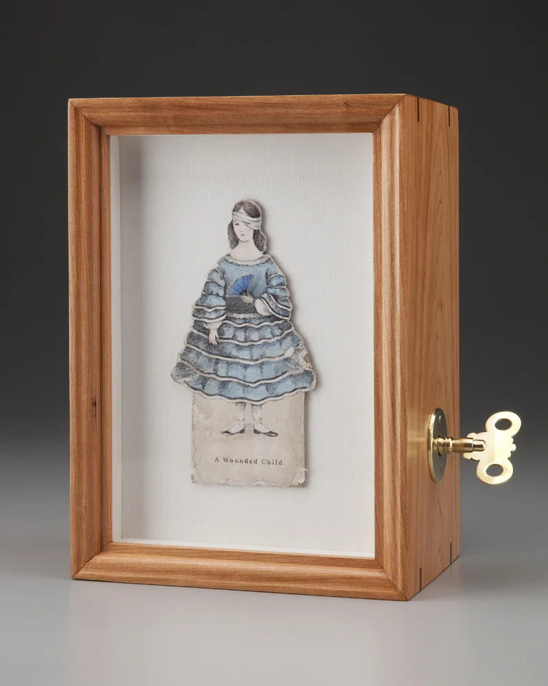 A Wounded Child $800 paper, colored pencil, acrylic, linen, cherry, mahogany, brass, self-fabricated mechanism w/ spring motor, hardware