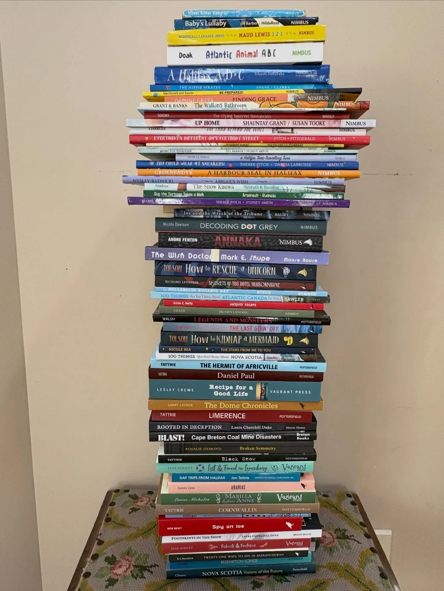 I started pulling books from our collection to share my stack of Nova Scotia published books. It took a loooong time because they were all over my house.

They were lined up on the bookcase, jammed into my kids&rsquo; shelves and headboards, stacked 