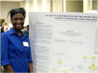 Student giving a poster presentation at a scientific conference.