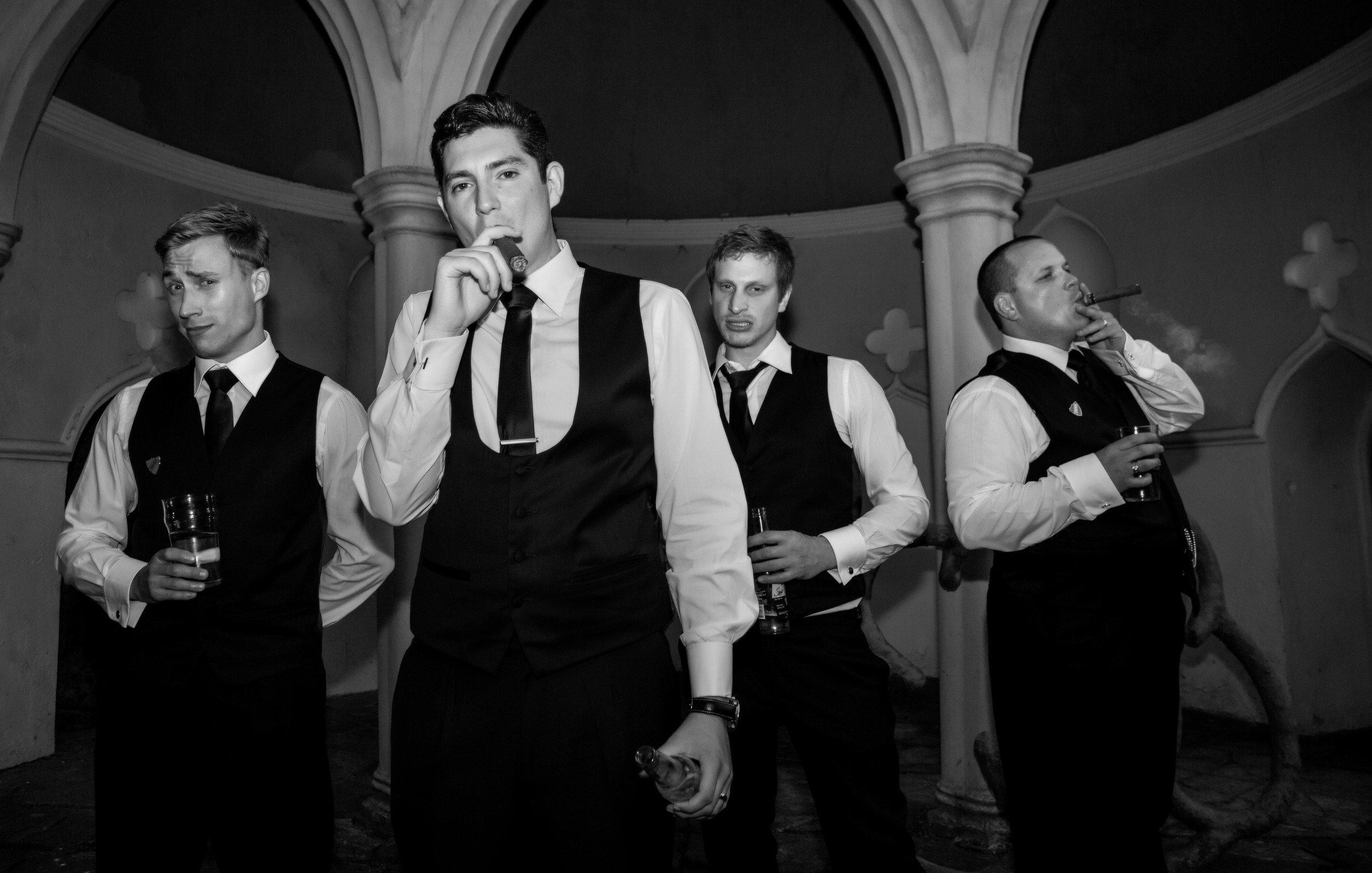 colchester-groomsmen-cigar-posing-london-uk-destination-wedding-photography-Adam-Rowley