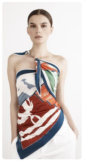 For the second style, you will need a large square scarf, at least 120cm wide along the edges, the larger the scarf the better! Fold the scarf into a triangle and hold the scarf over your chest with the right angle pointing down. Wrap both corners around your back, bring the left corner up towards your right shoulder and take the right corner underneath your arm back towards the front. You should have both corners up on your chest at this stage, simply tie a knot to hold, you can also use a pretty brooch instead! 
