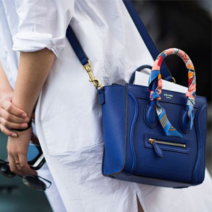 Or try wrapping your scarf all the way covering the handle completely. This look is best suited for structured bags.