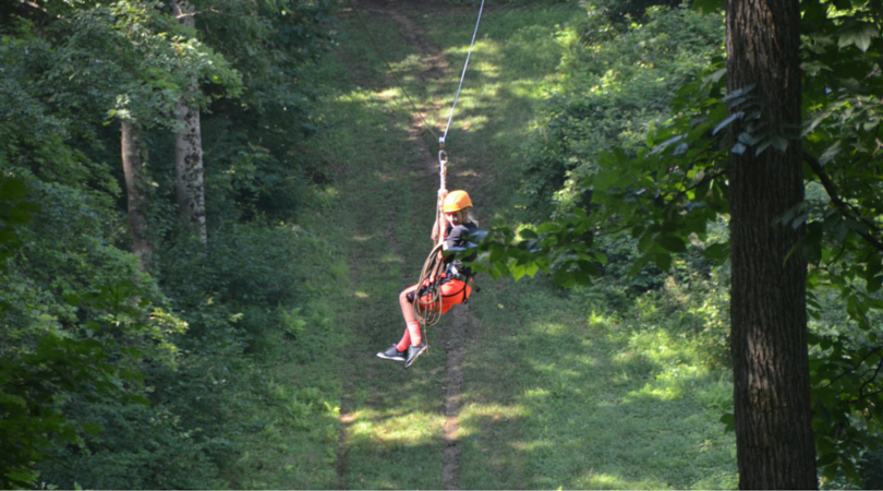 Zip lining across the woodlands of the swva 4-h center