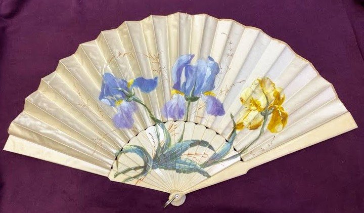 📣 Weekly Artifact Spotlight #16:

In honor of May Day, we suggest everyone carry a floral folding fan such as this one, possibly hand-decorated by the owner or a friend. What makes this 19th-century fan unusual is the extension of the iris image ont