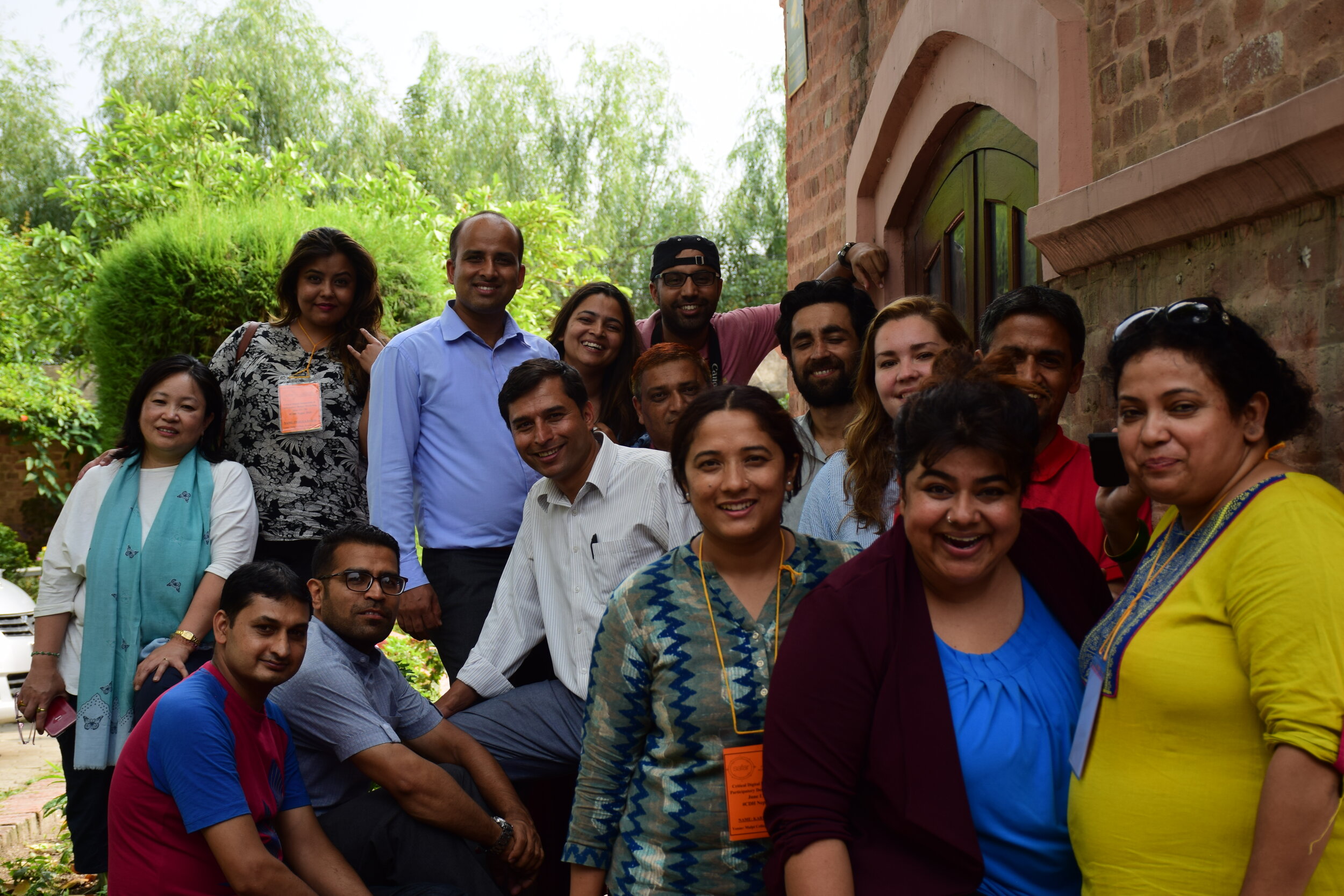 Participants from the Participatory Design workshop series in Kathmandu hang out outside Malpi college. 