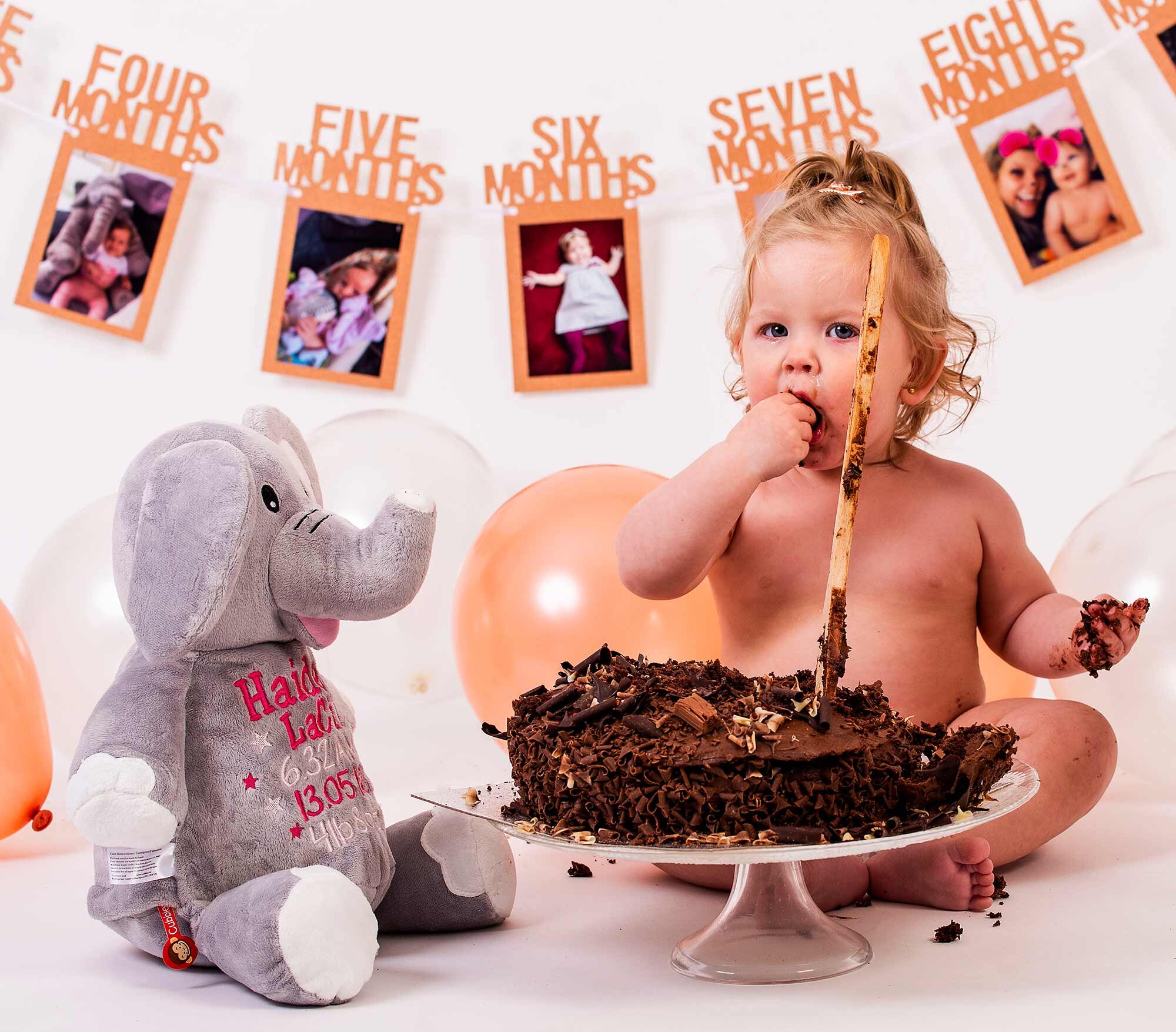 Cake smash photo session by friendly, experienced Sussex photographer